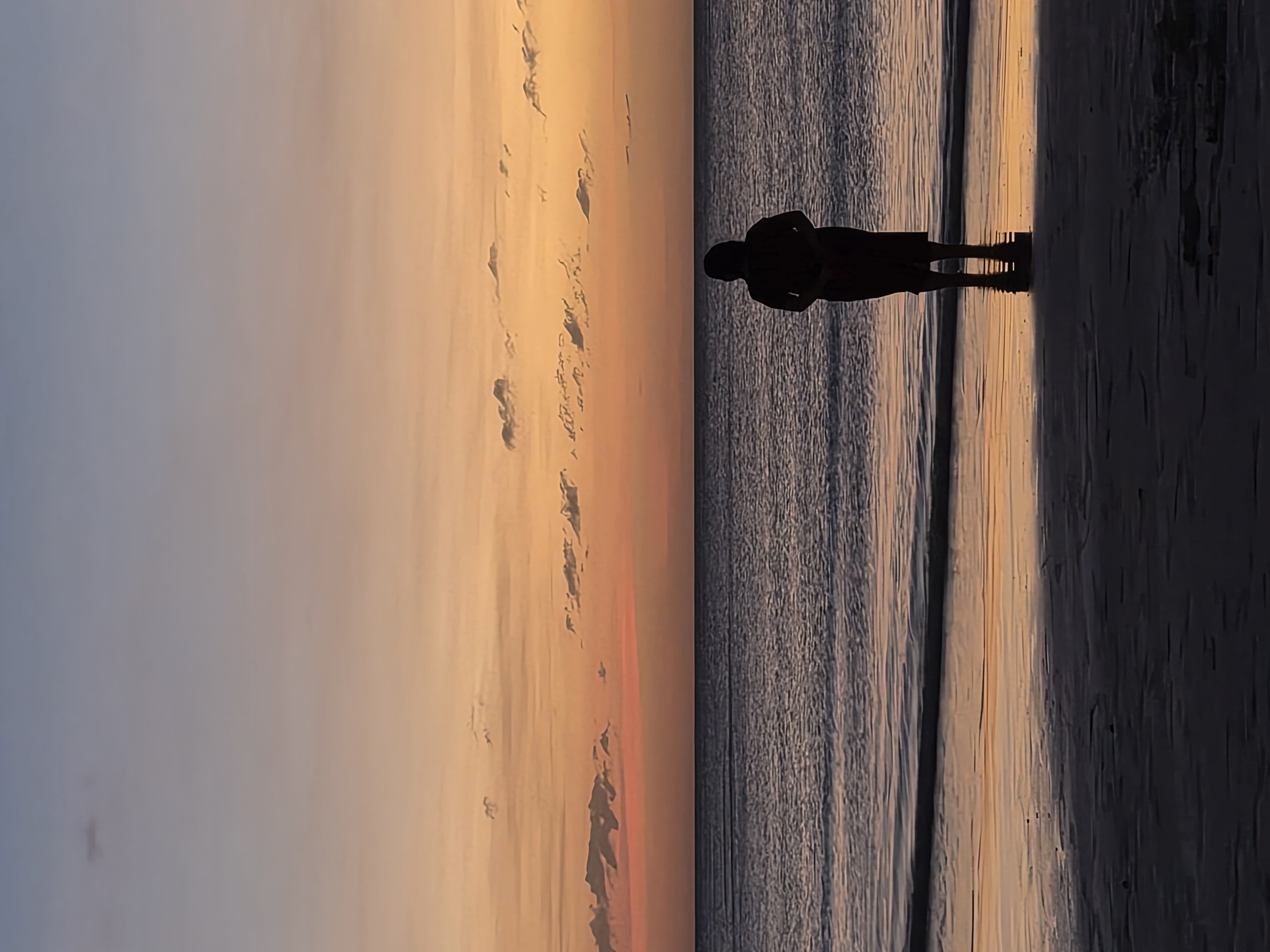 A quiet moment at the edge of the sea during sunset.